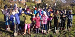 children, parents and staff from World’s End Junior School in Quinton helping to plant ten large trees
