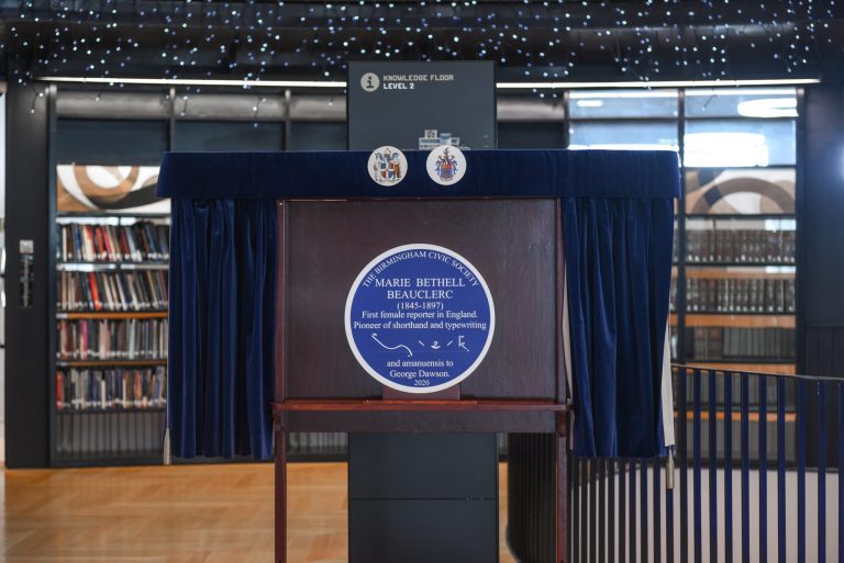 Mounted blue plaque to Marie Bethell Beauclerc with text reading: First female reporter in England. Pioneer of shorthand and typewriting and amaneunsis to George Dawson. Pitman shorthand also features.